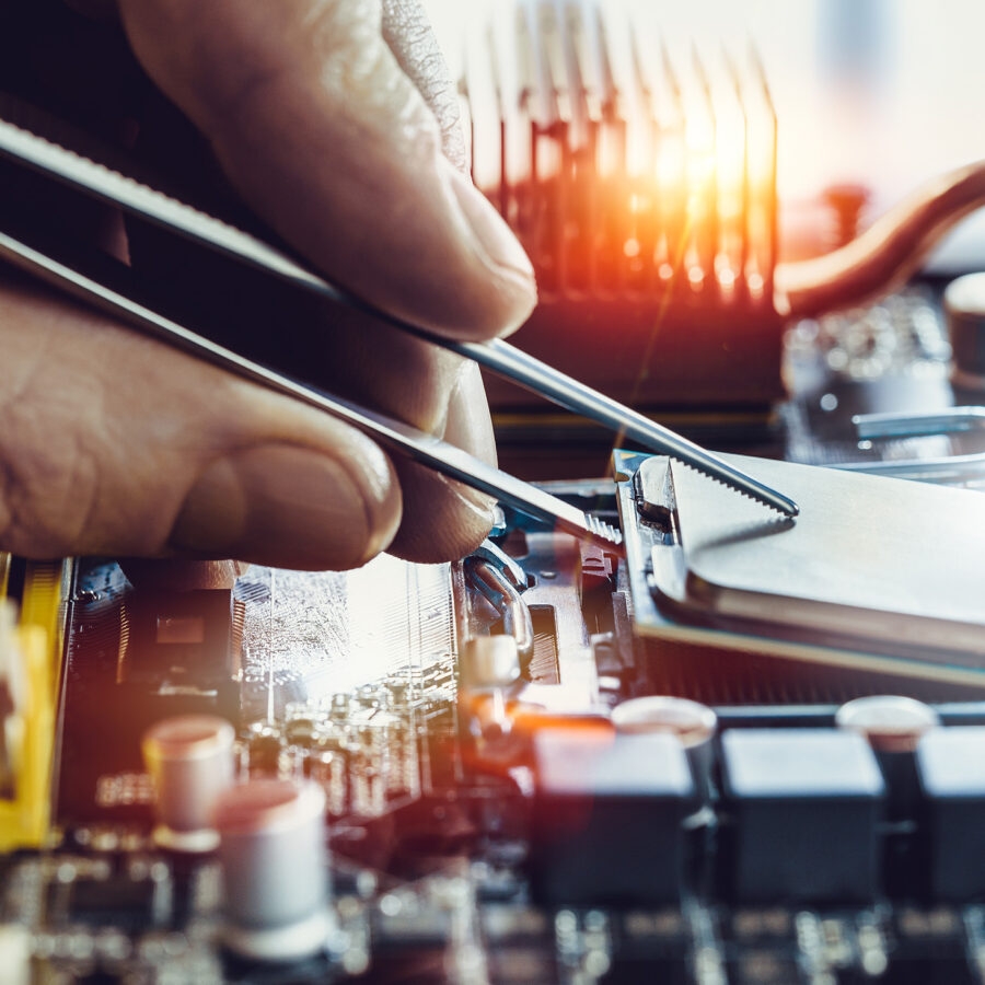 Engineer fixing computer